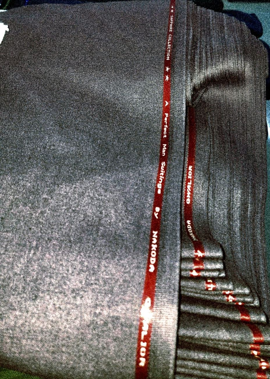 Woven selvedge edge of Sapphire Collection fabric, showing the Shree Nakoda Impex brand name